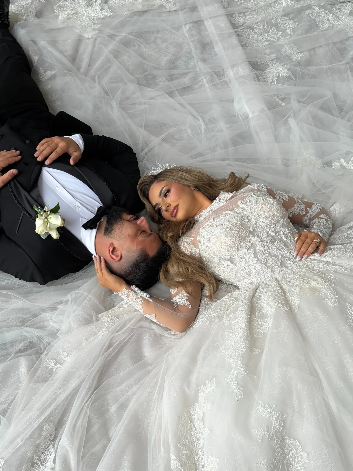 Couple under a tulle veil